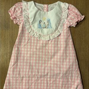 Pink and white gingham bib dress with shadow embroidery nativity scene